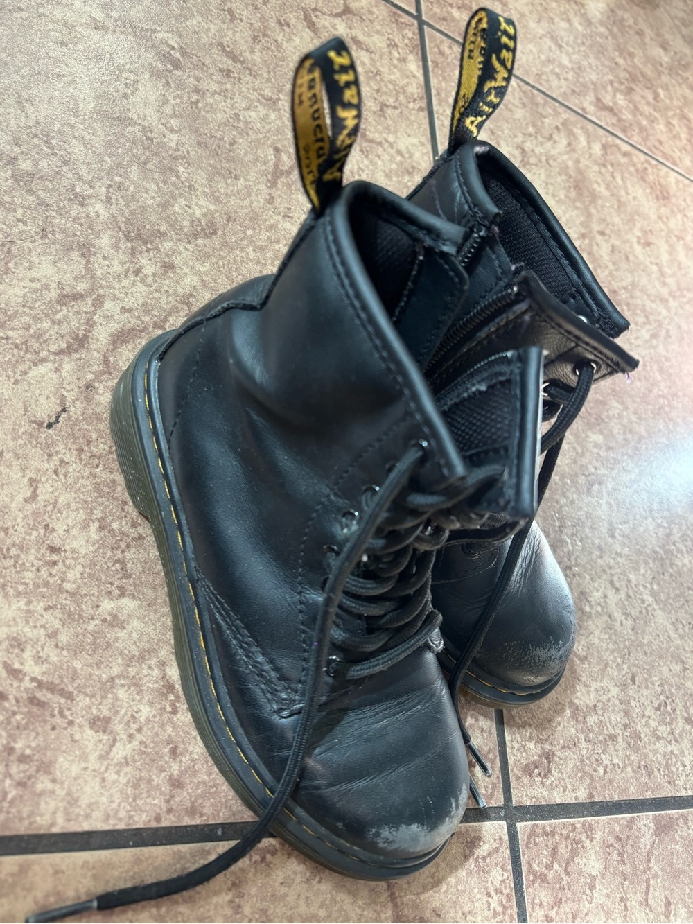 Kids Dr. Martens Black Leather Lace-Up 8-Eye Boots with Yellow Heel Tabs